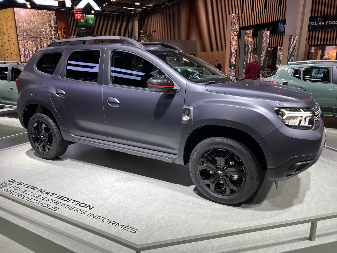 Matte SUV side profile with black wheels and LED headlights