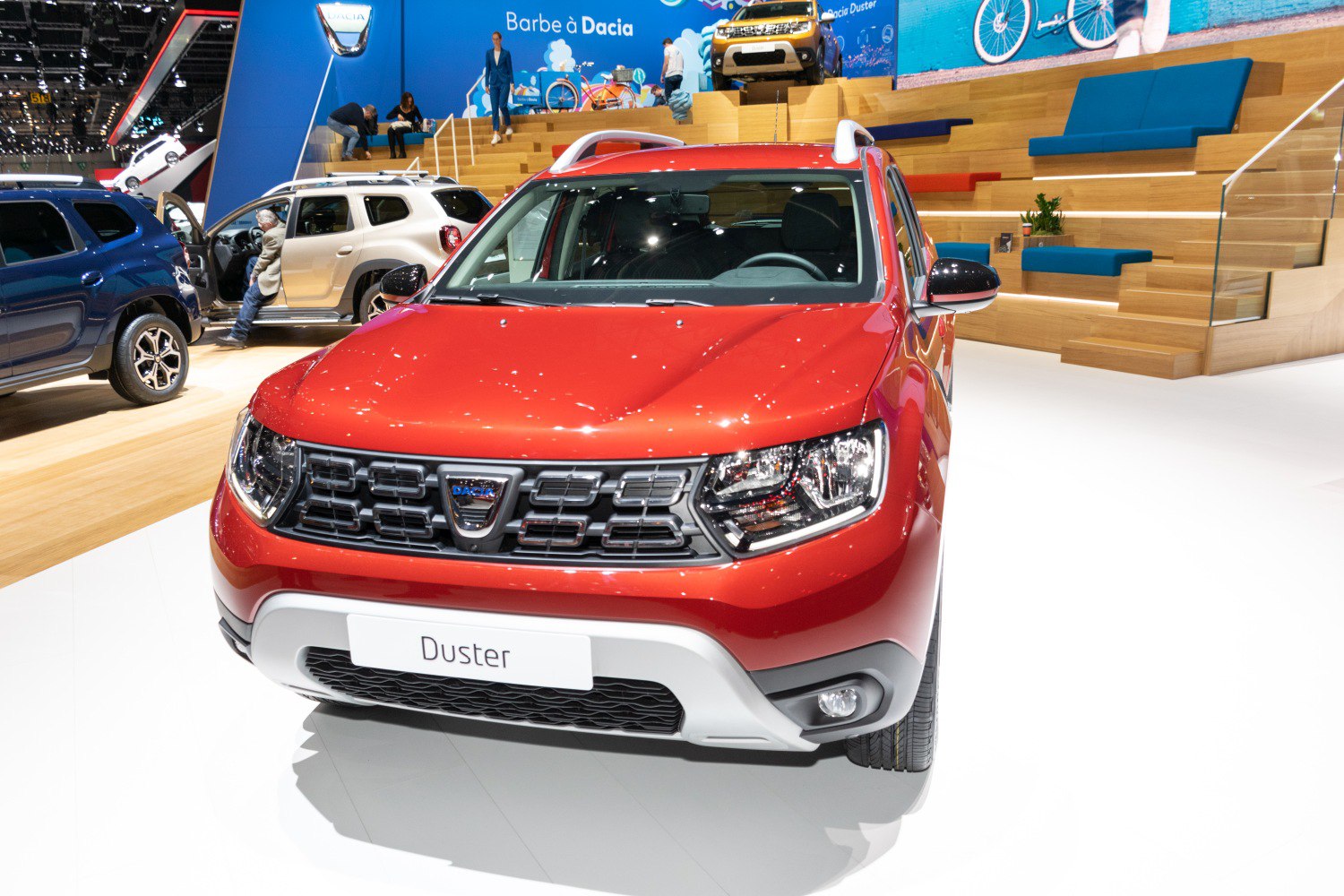 Front view of red SUV with distinctive grille and headlights