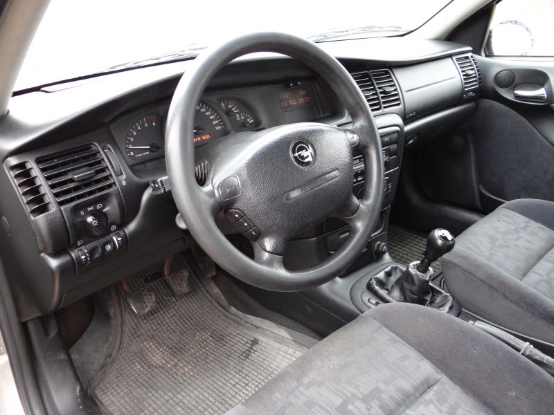 Dashboard, steering wheel, and manual transmission interior focus