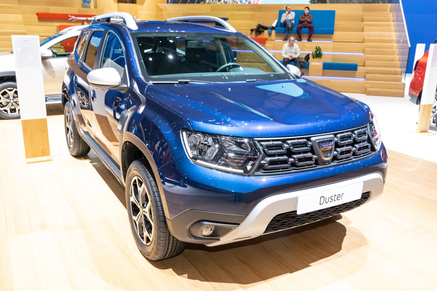 Blue SUV front-side with bold grille and LED headlights
