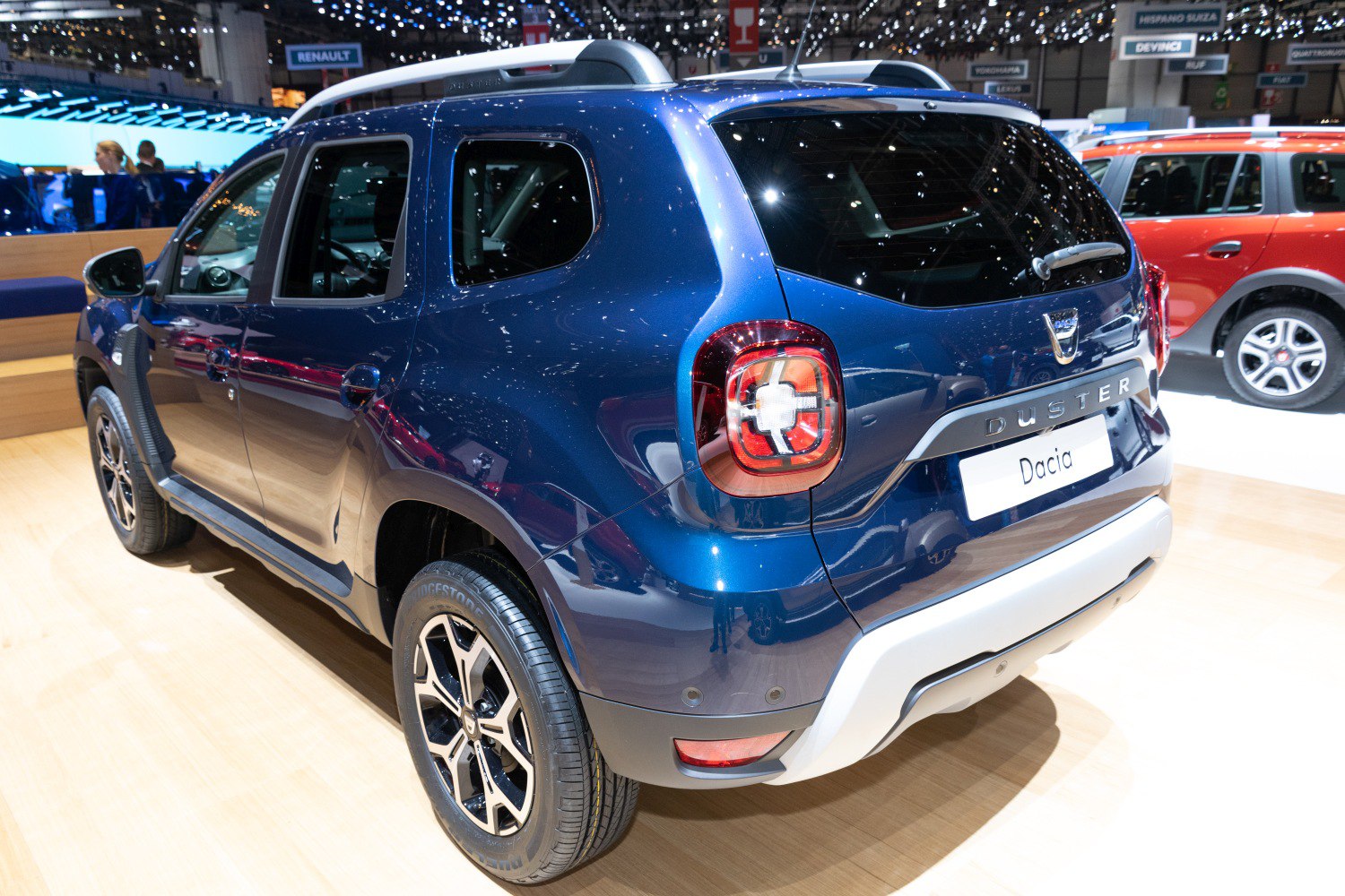 SUV rear view with distinctive tail light and alloy wheel design