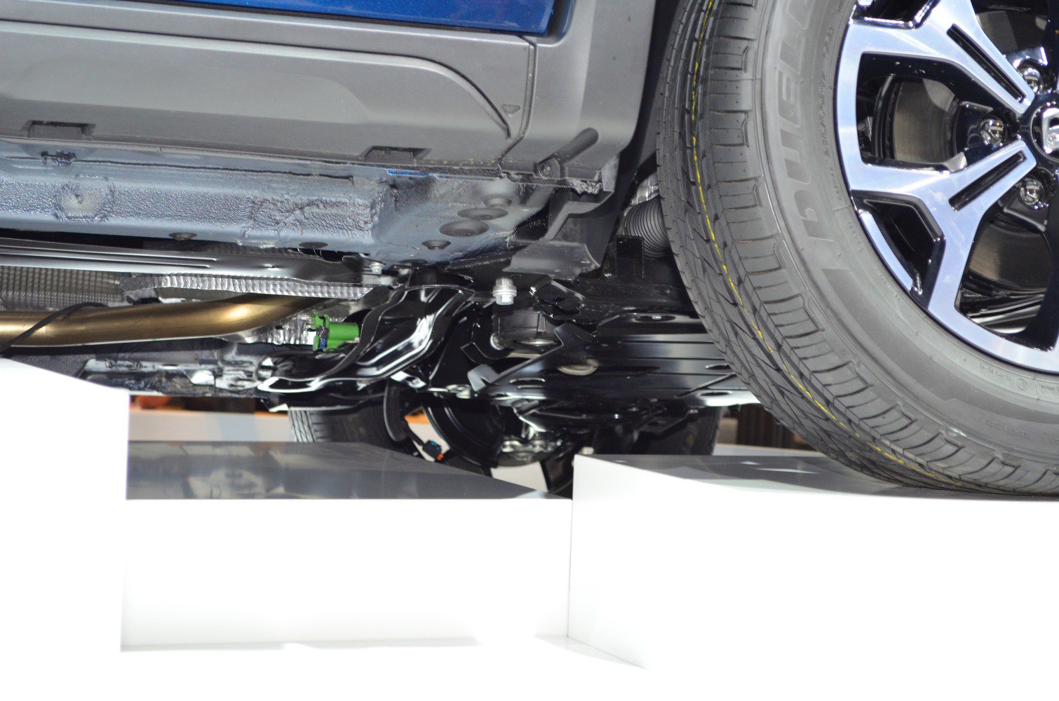 Close-up of underbody and rear suspension with wheel