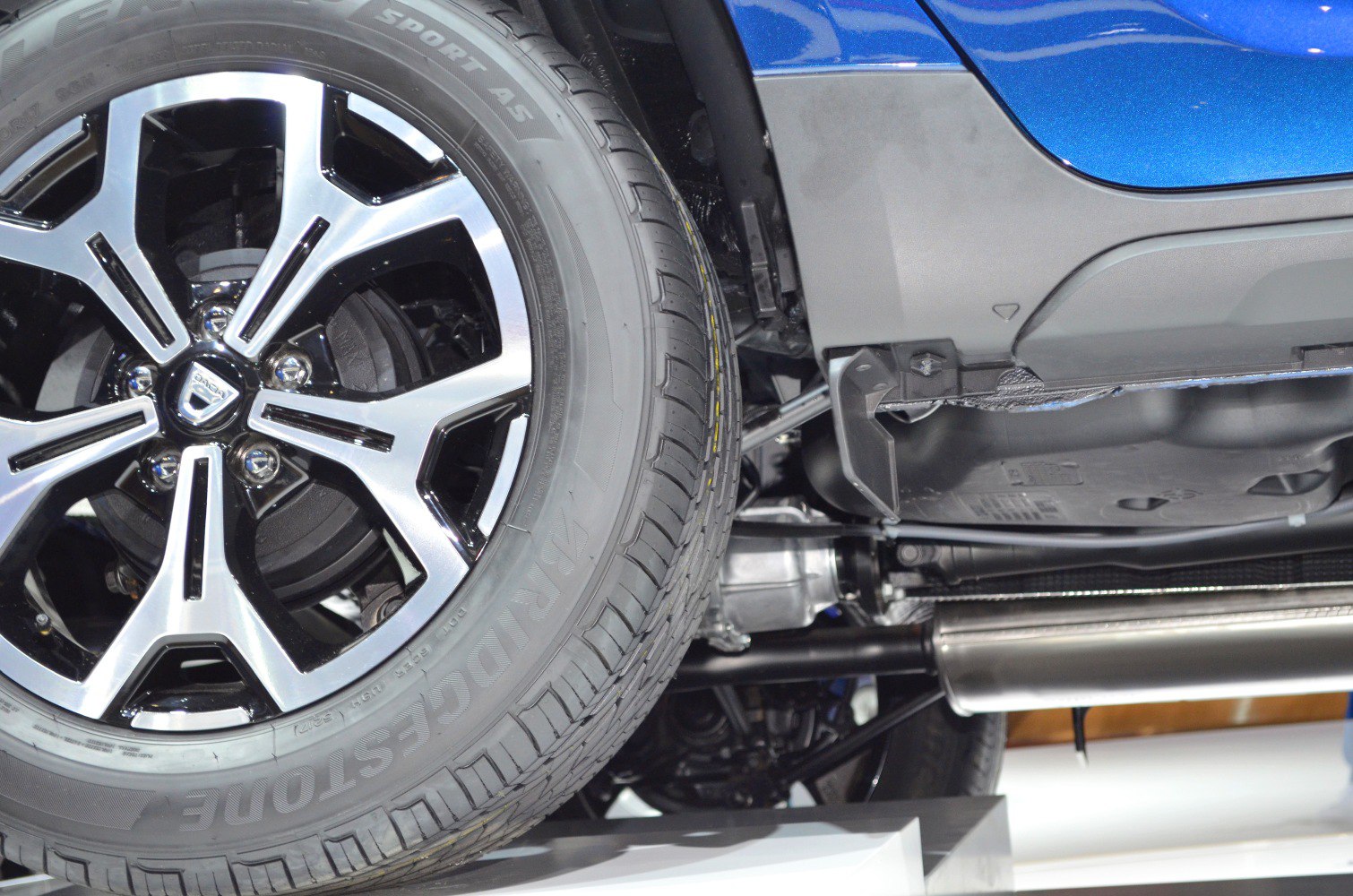Alloy wheel and exhaust system with suspension parts visible