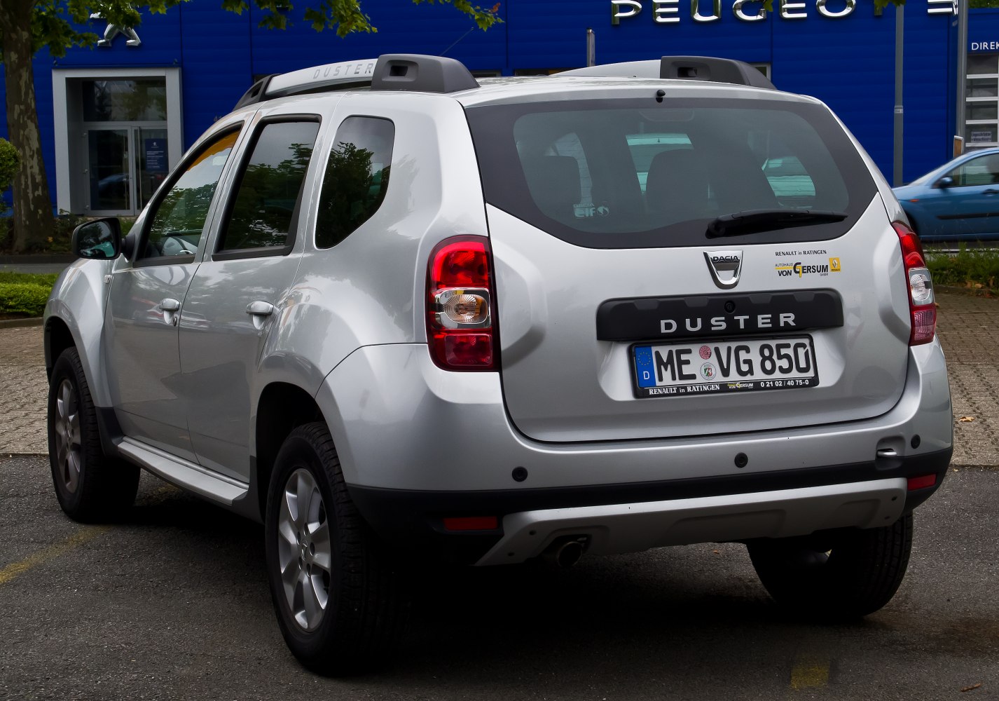 Rear hatchback with tail lights and roof rails