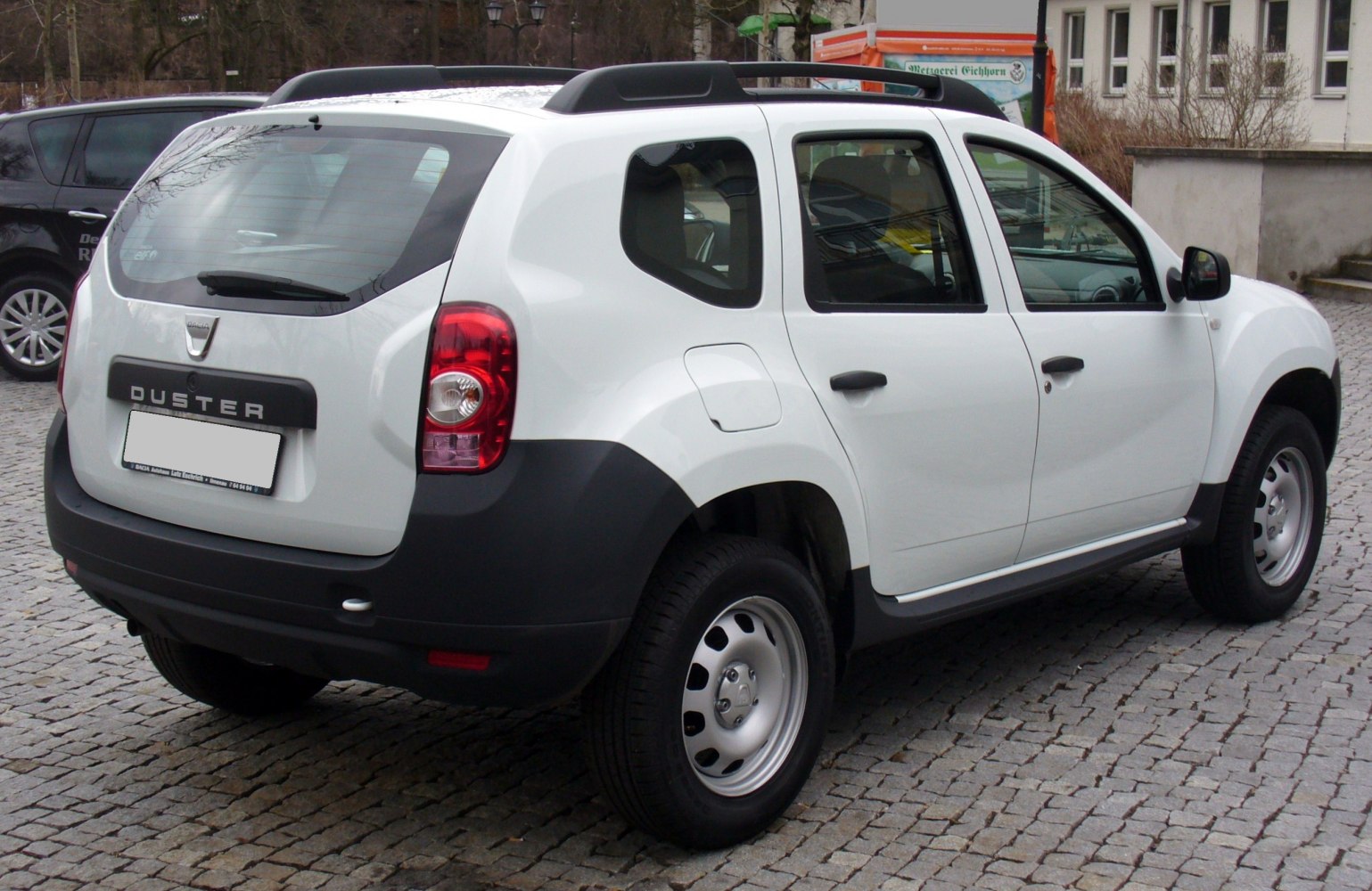 Rear and side profile with black bumper cladding and steel wheels.