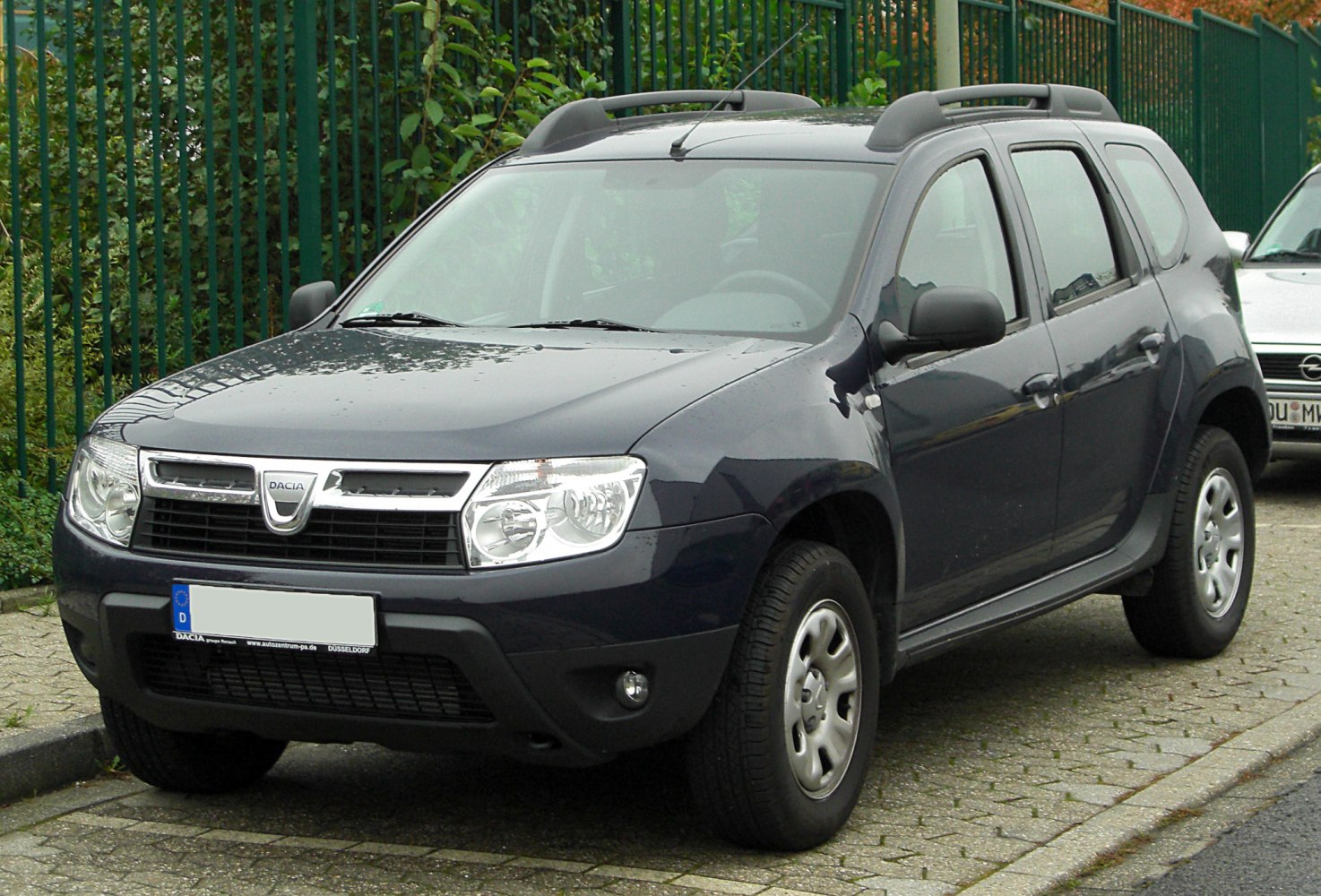 Front and side view of SUV with roof rails and rugged styling