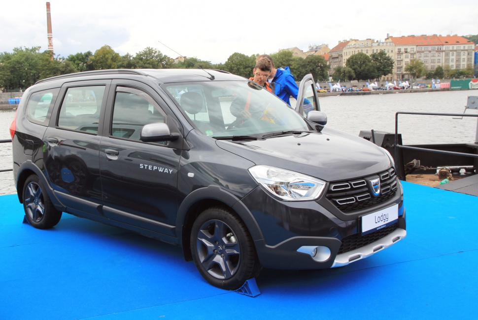 Front-side exterior view of Dacia Lodgy Stepway on blue surface.