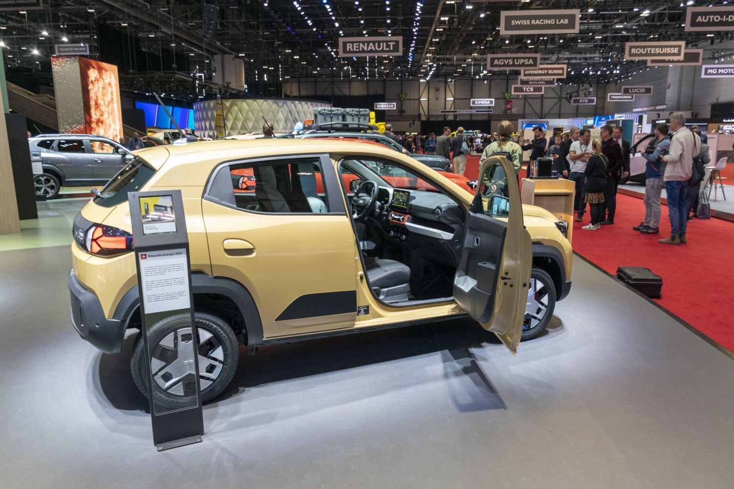 Side profile and interior view with open front door of a compact SUV