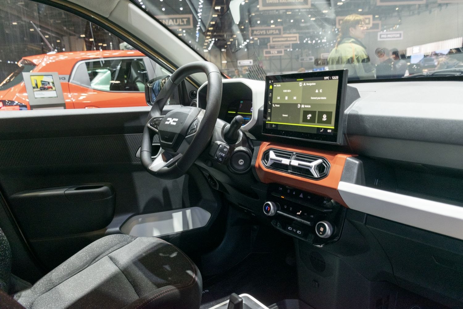 Digital dashboard and touchscreen infotainment in compact electric vehicle interior