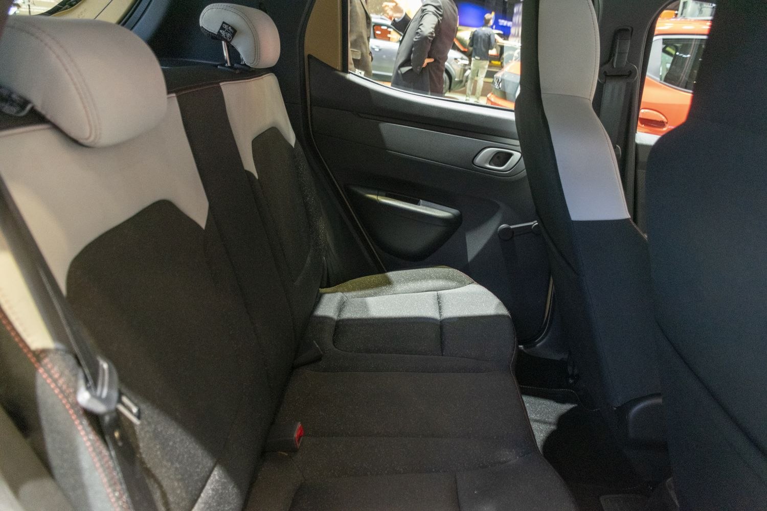 Rear seat interior with modern upholstery and compact space
