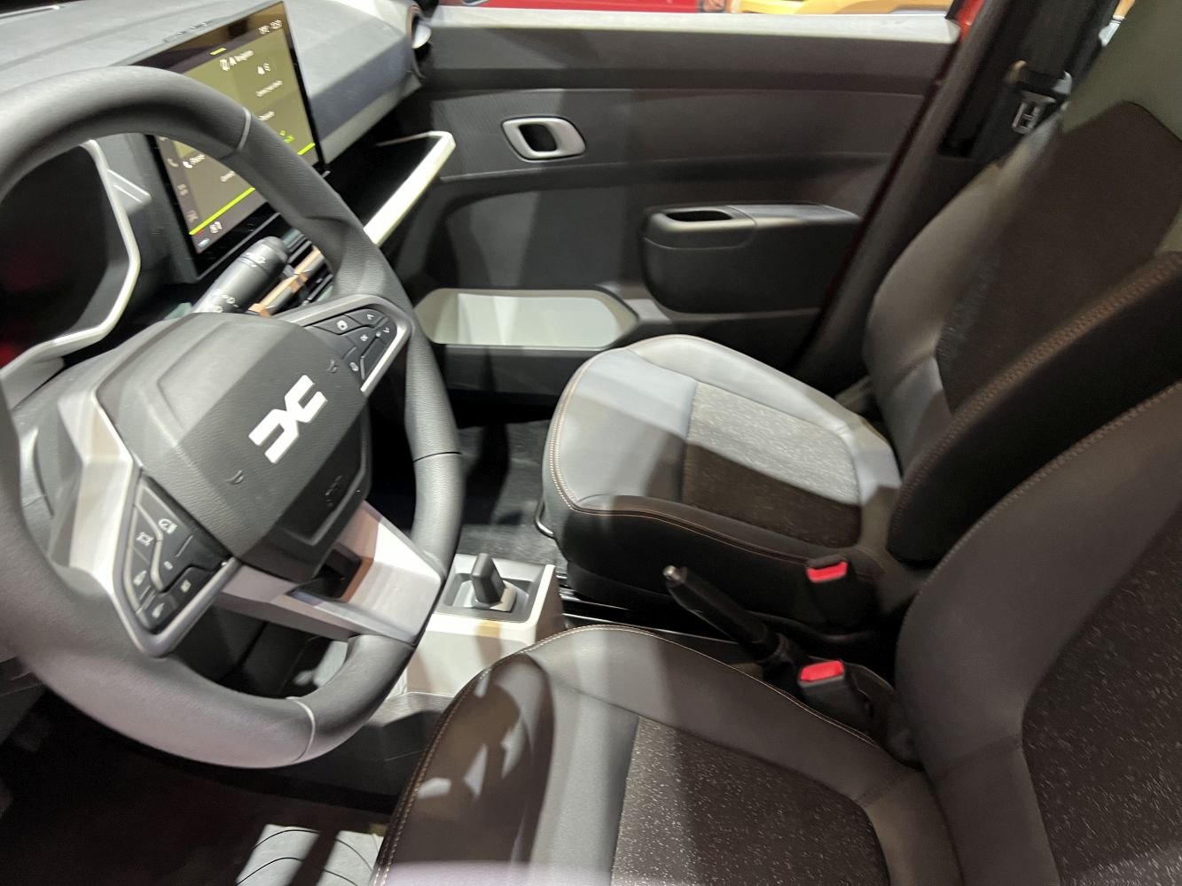 Updated EV interior with multifunction steering wheel and modern dashboard display