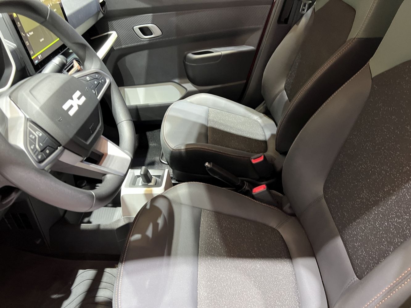 Modern front seats and updated steering wheel with dashboard layout