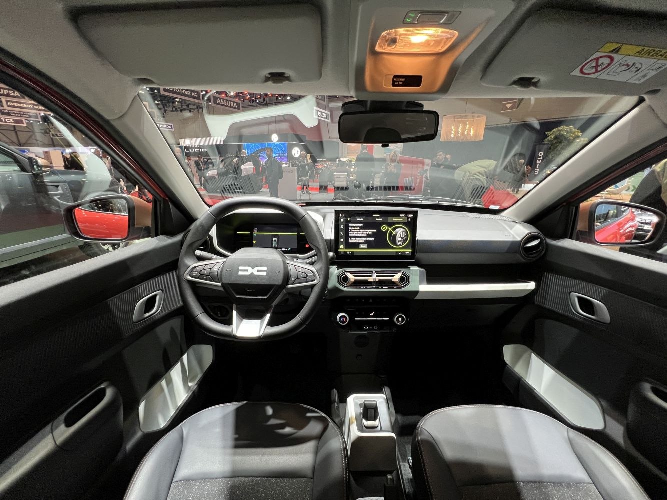 Digital dashboard and central touchscreen in compact electric vehicle interior