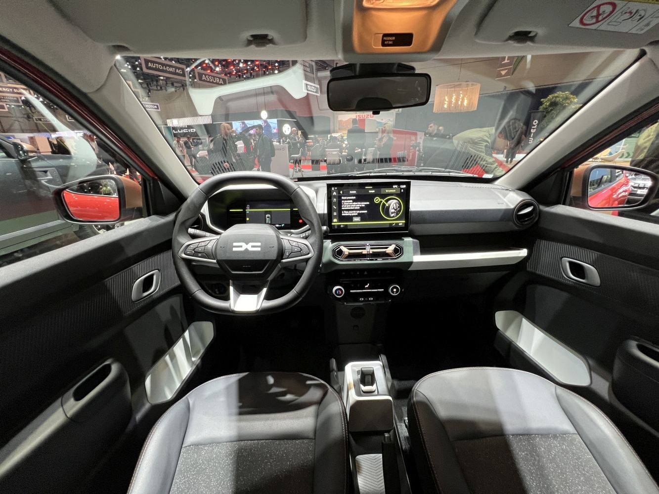 Modern digital dashboard and touchscreen infotainment in compact electric vehicle interior