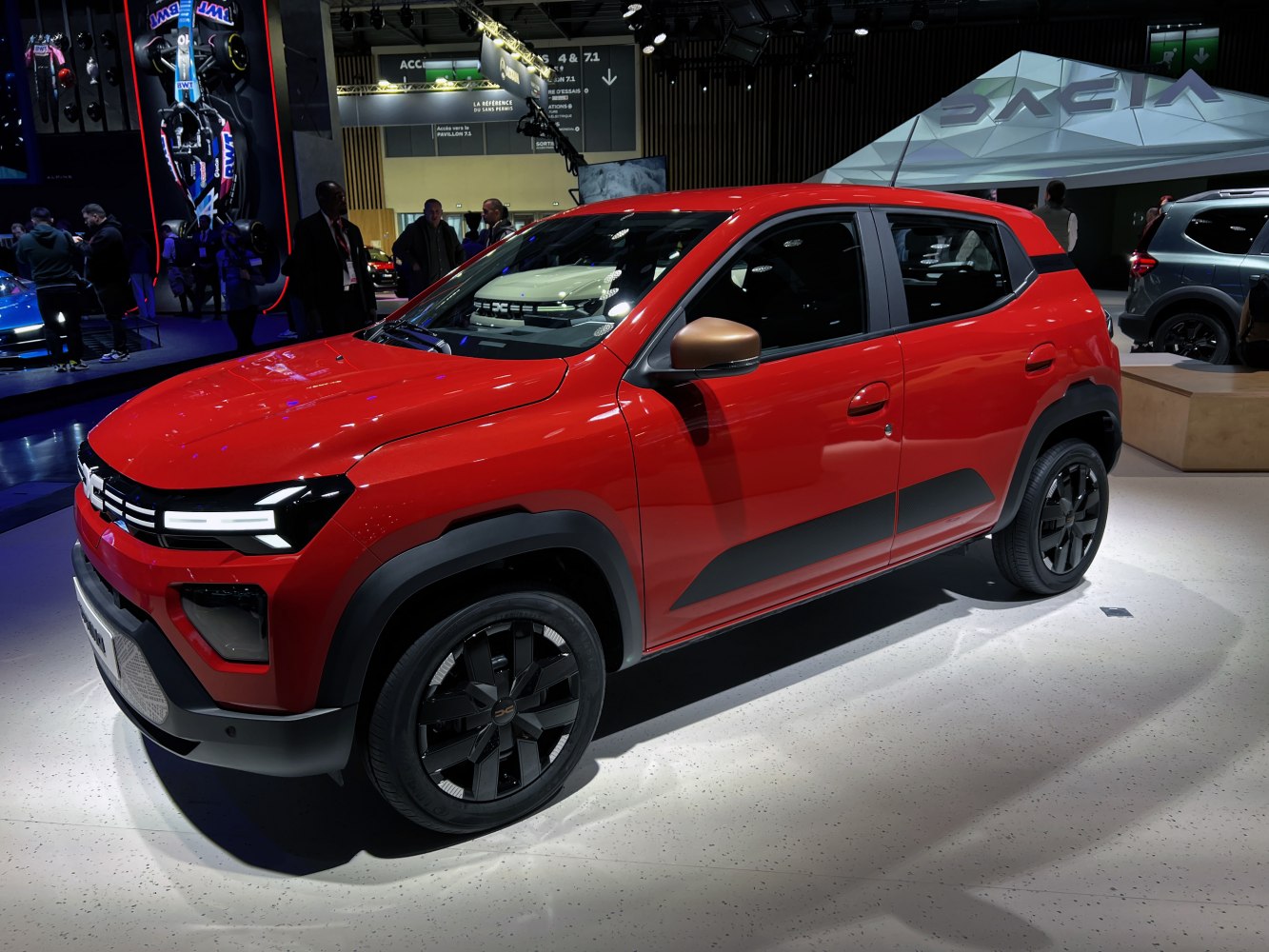 Sharp LED headlights and rugged body cladding on modern SUV with black alloy wheels.