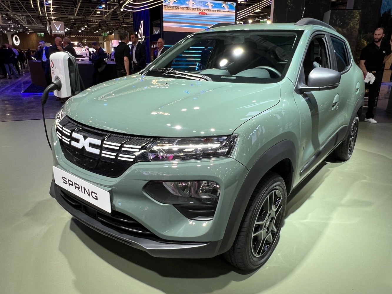 Front-side view of electric compact SUV with charging plug