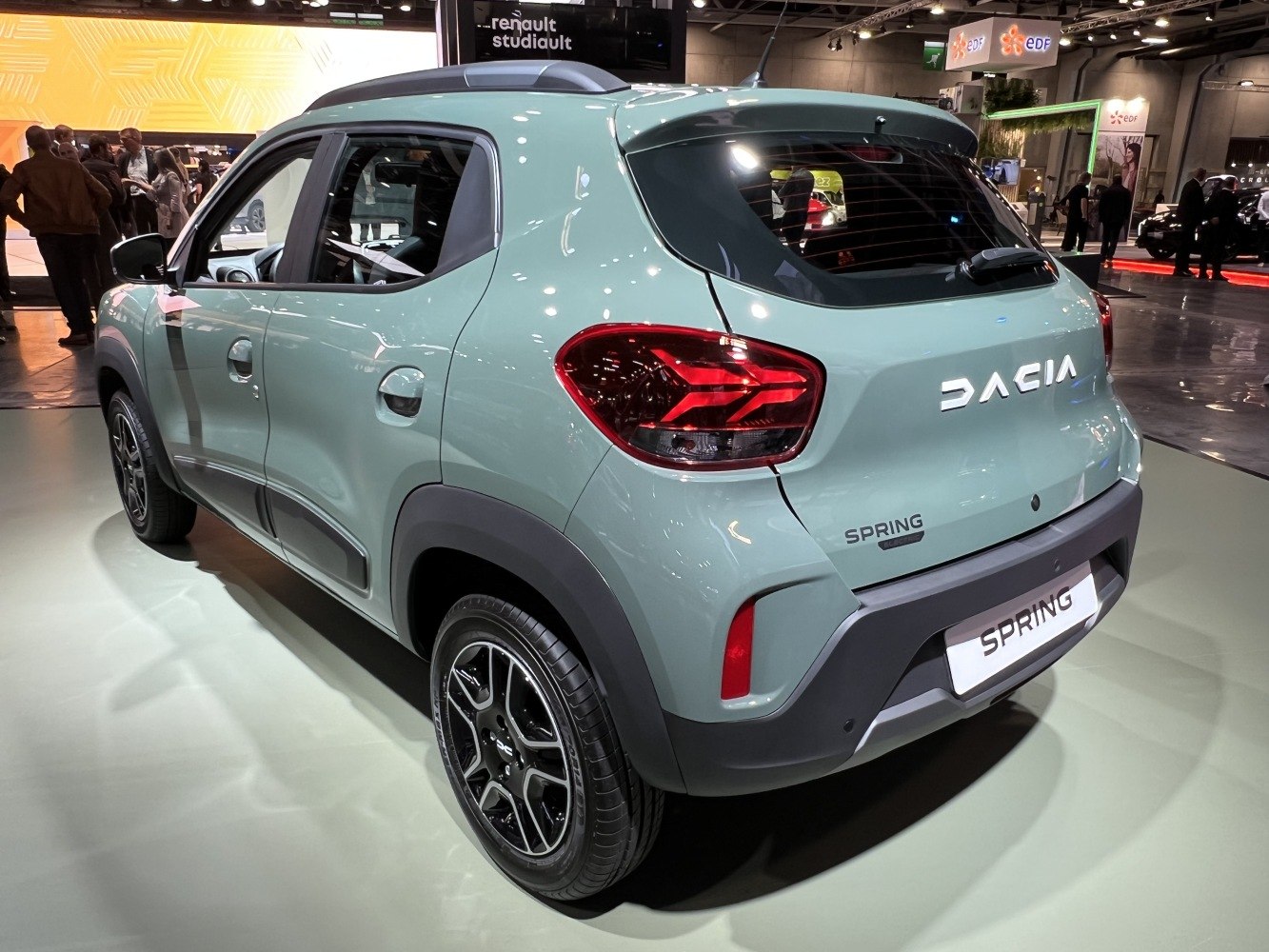 Rear and side profile of facelifted compact electric vehicle with updated taillights.