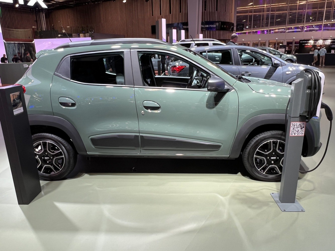 Compact electric SUV side profile with charging port and alloy wheels