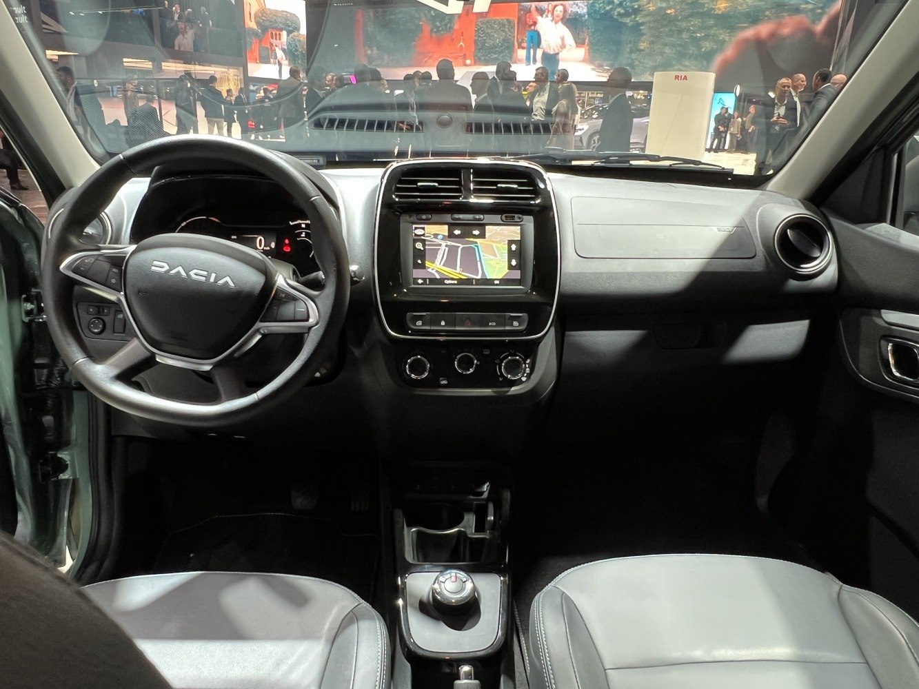 Dashboard with steering wheel, central touchscreen, and gear selector