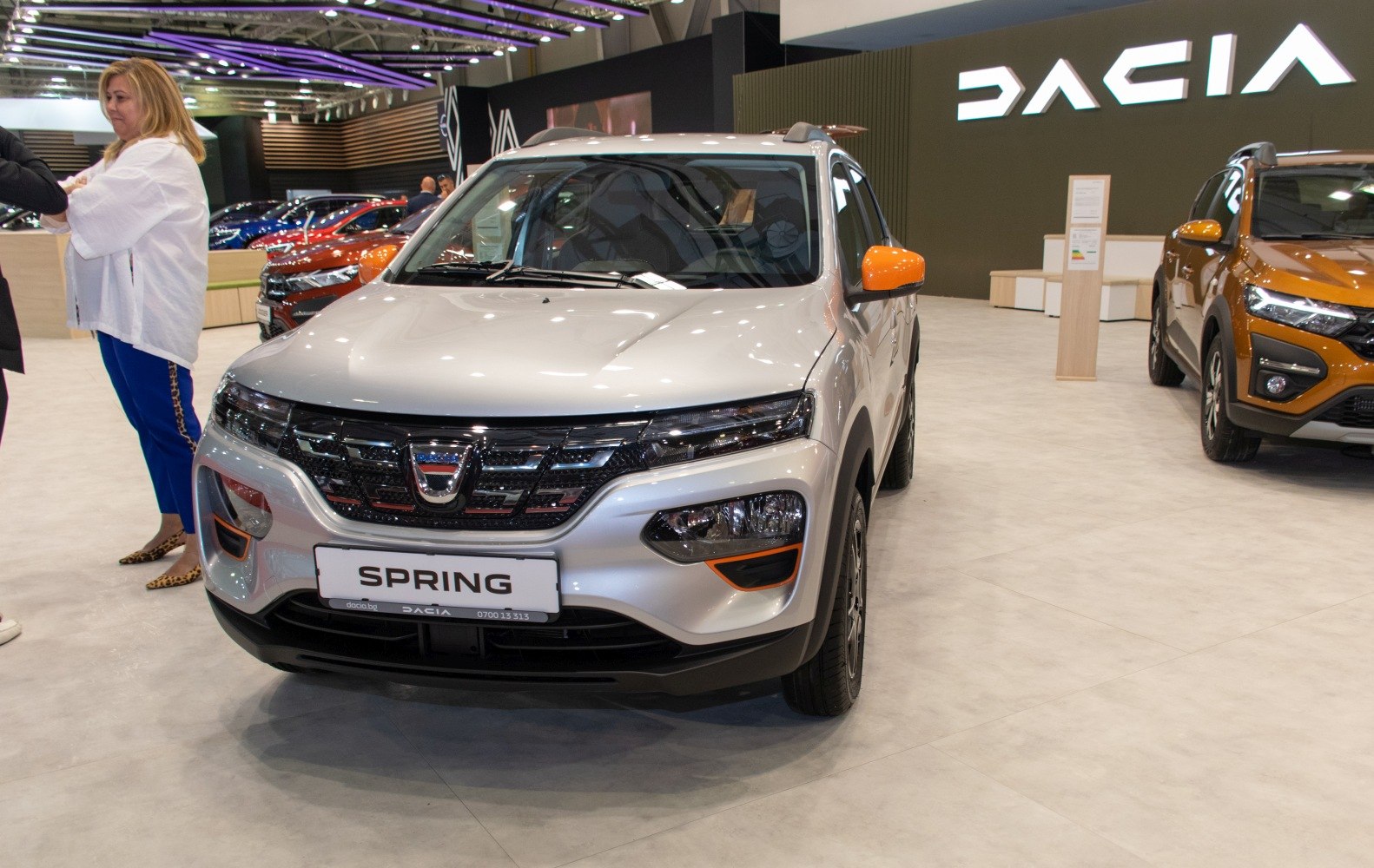 Compact SUV front with orange side mirrors and split headlights