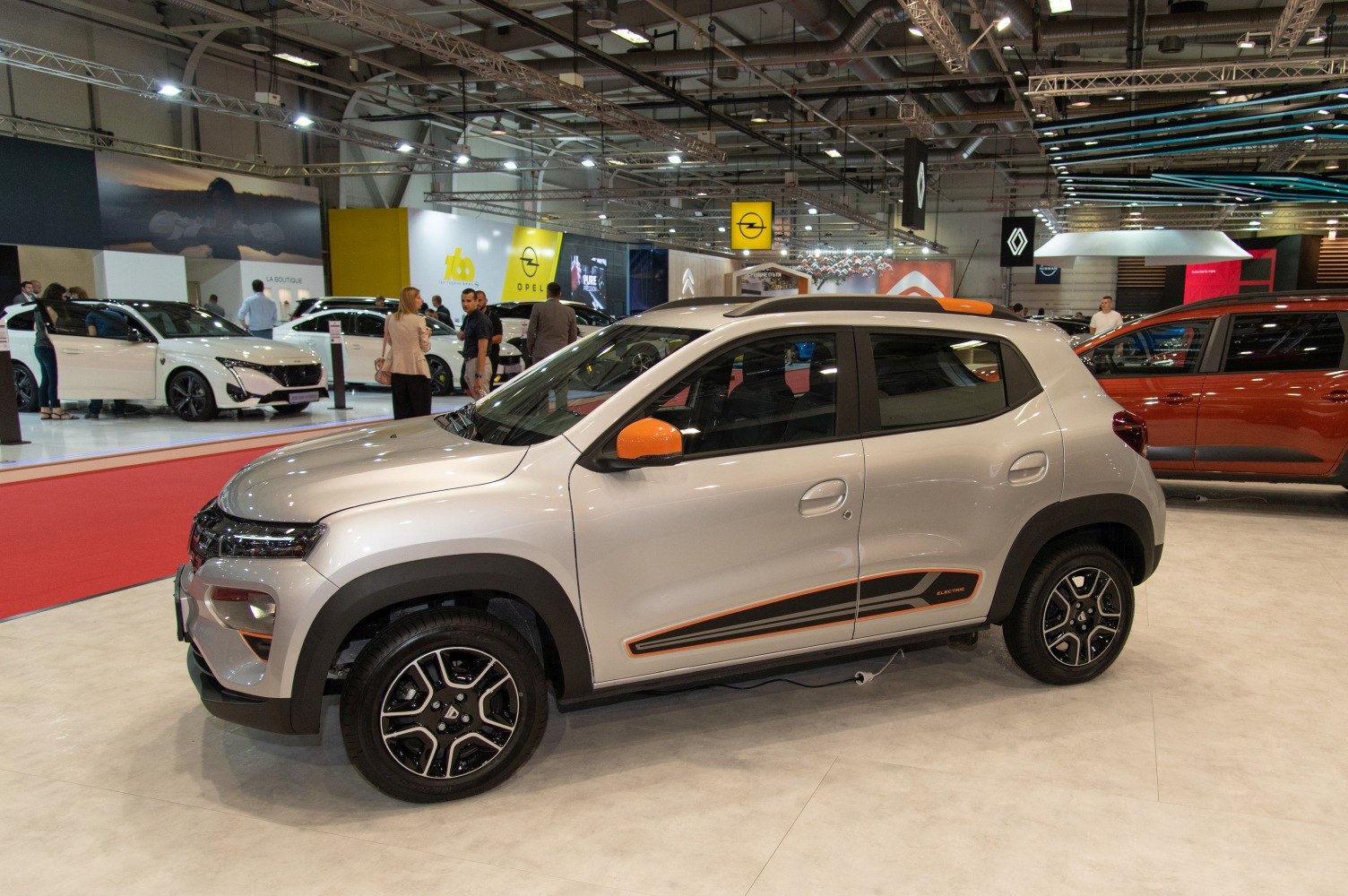 Electric subcompact SUV with orange mirror accents and modern alloy wheels