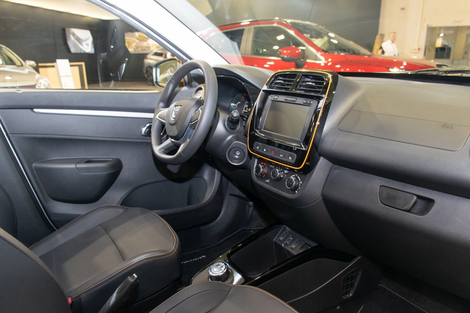 Dashboard, touchscreen display, steering wheel, and climate controls
