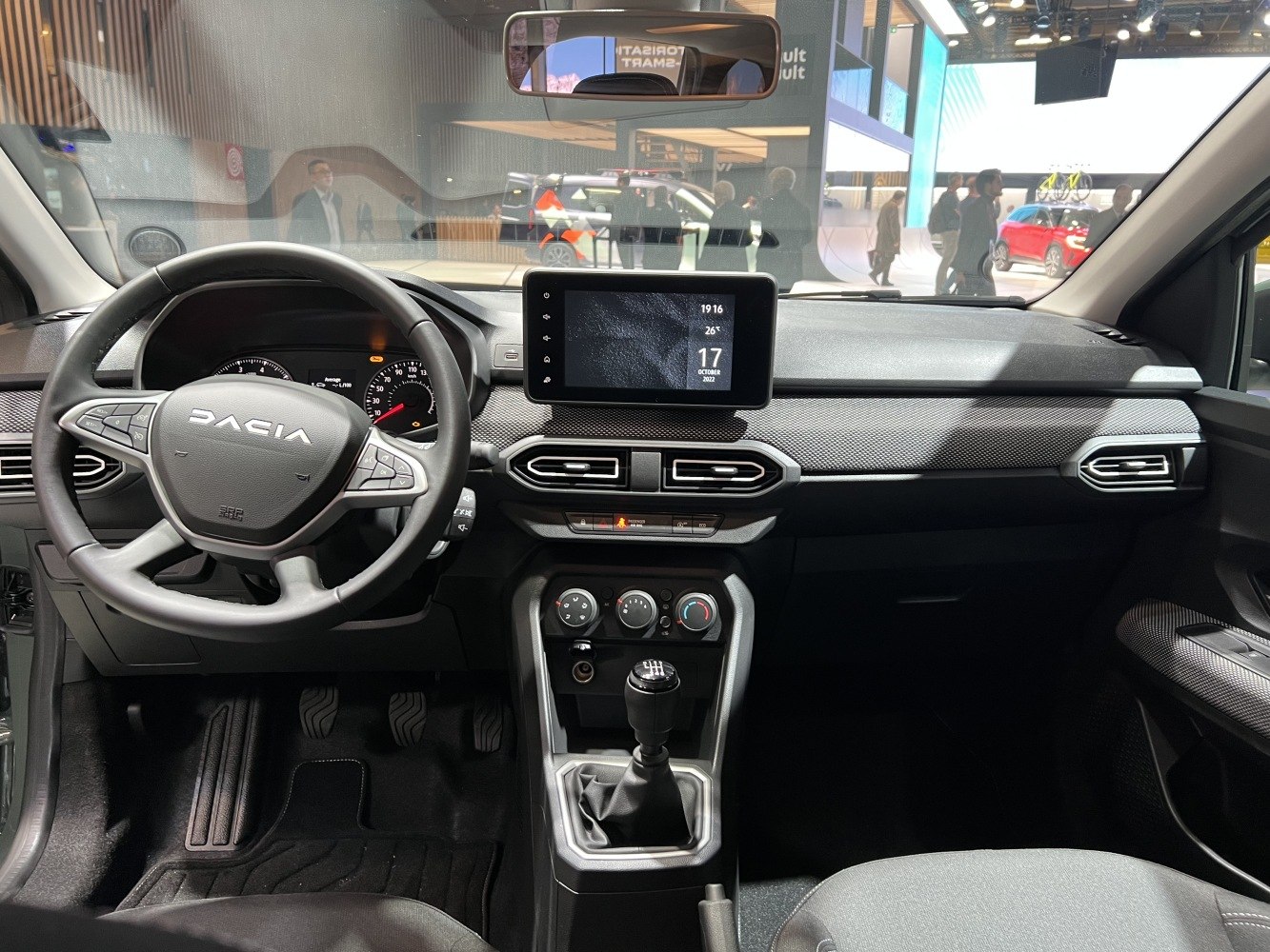 Modern car interior with touchscreen and manual gearshift