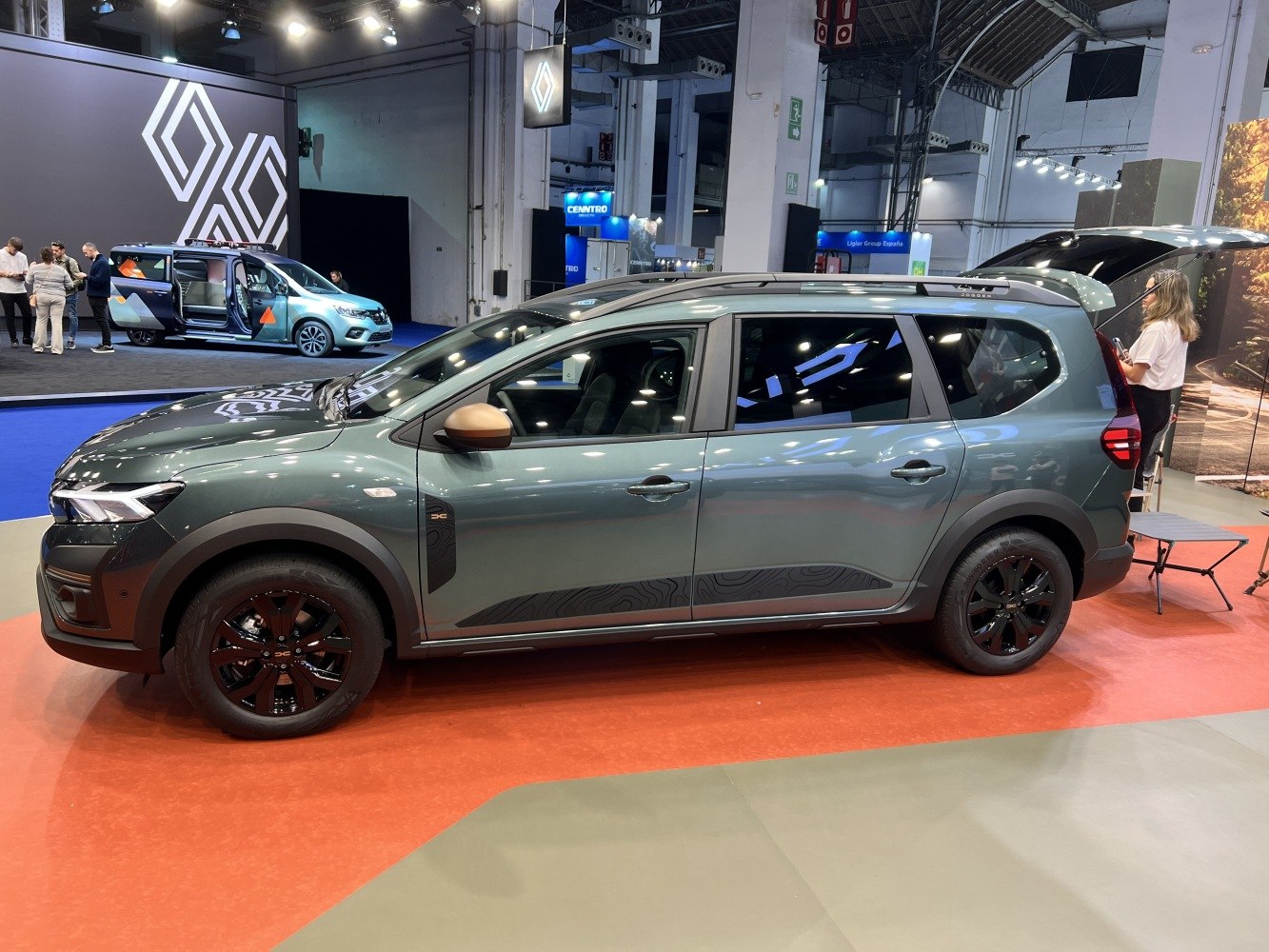 Side view of a midsize vehicle with black alloy wheels and updated body styling
