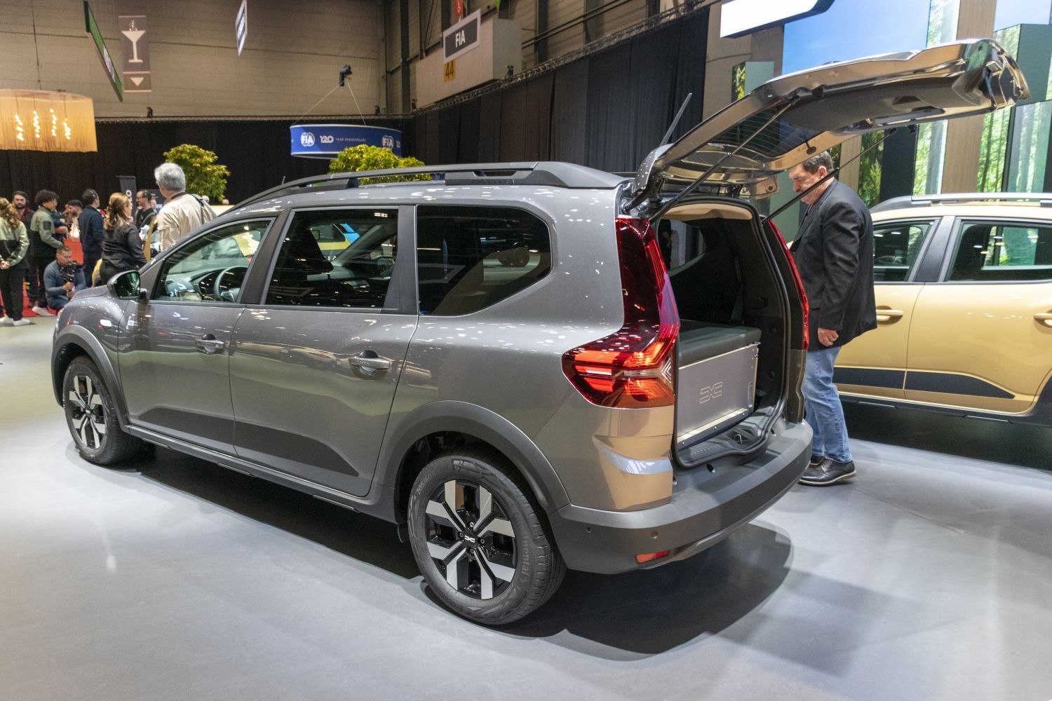 Open rear hatch with visible spacious cargo area and modern rear taillights