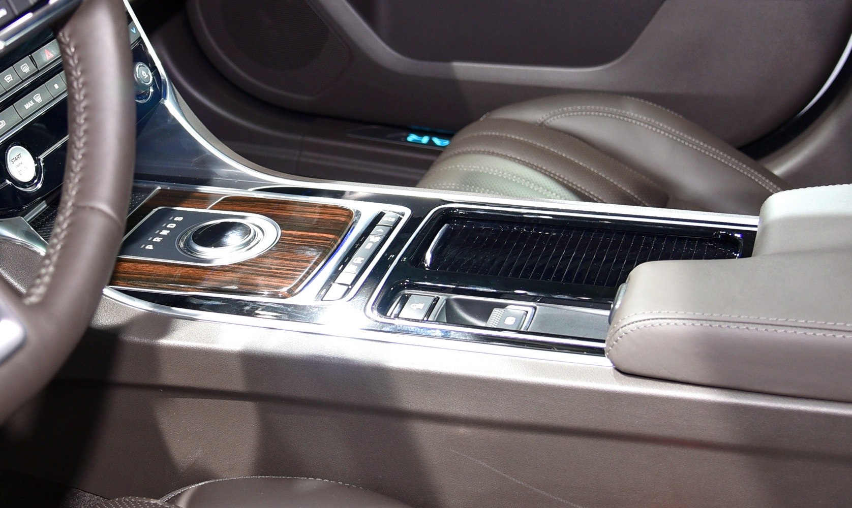 Rotary gear selector and wood-trimmed center console with leather seats