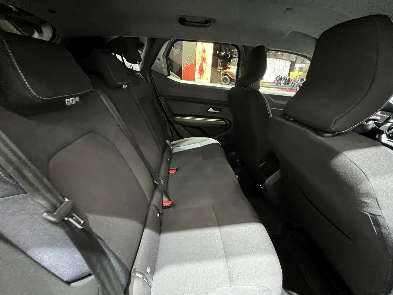 Spacious rear seats with black fabric upholstery and ergonomic design