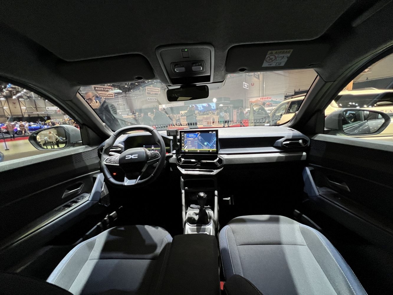 Modern interior with digital dashboard and manual gearshift