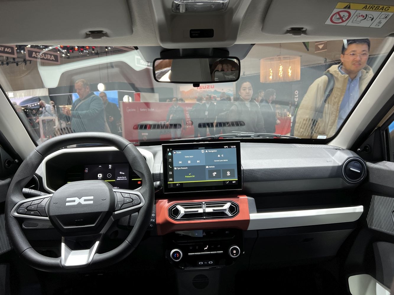 Modern steering wheel with integrated controls and central touchscreen display