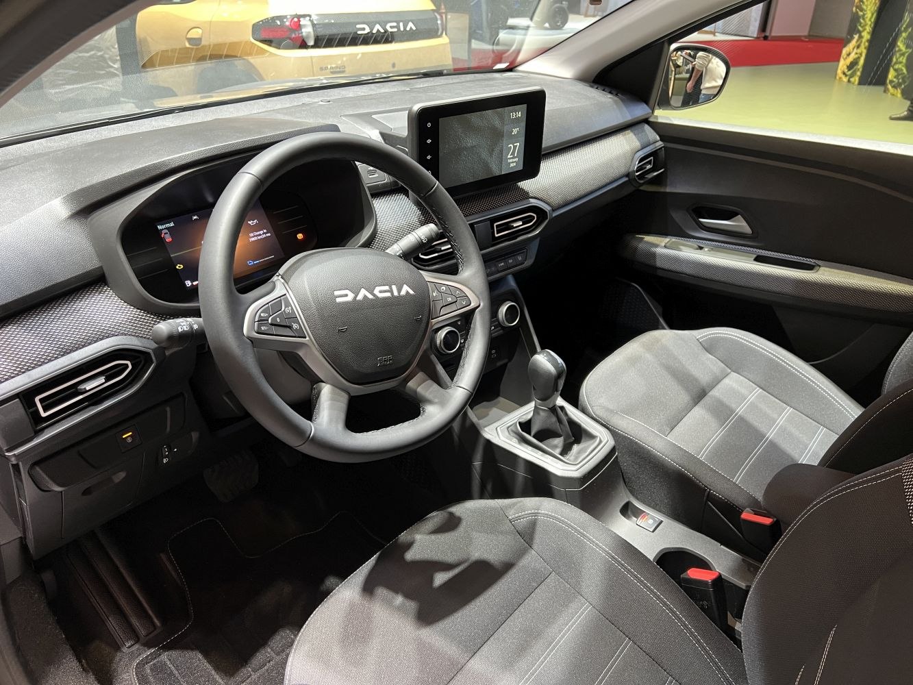 Modern car interior with digital displays and multifunction steering wheel