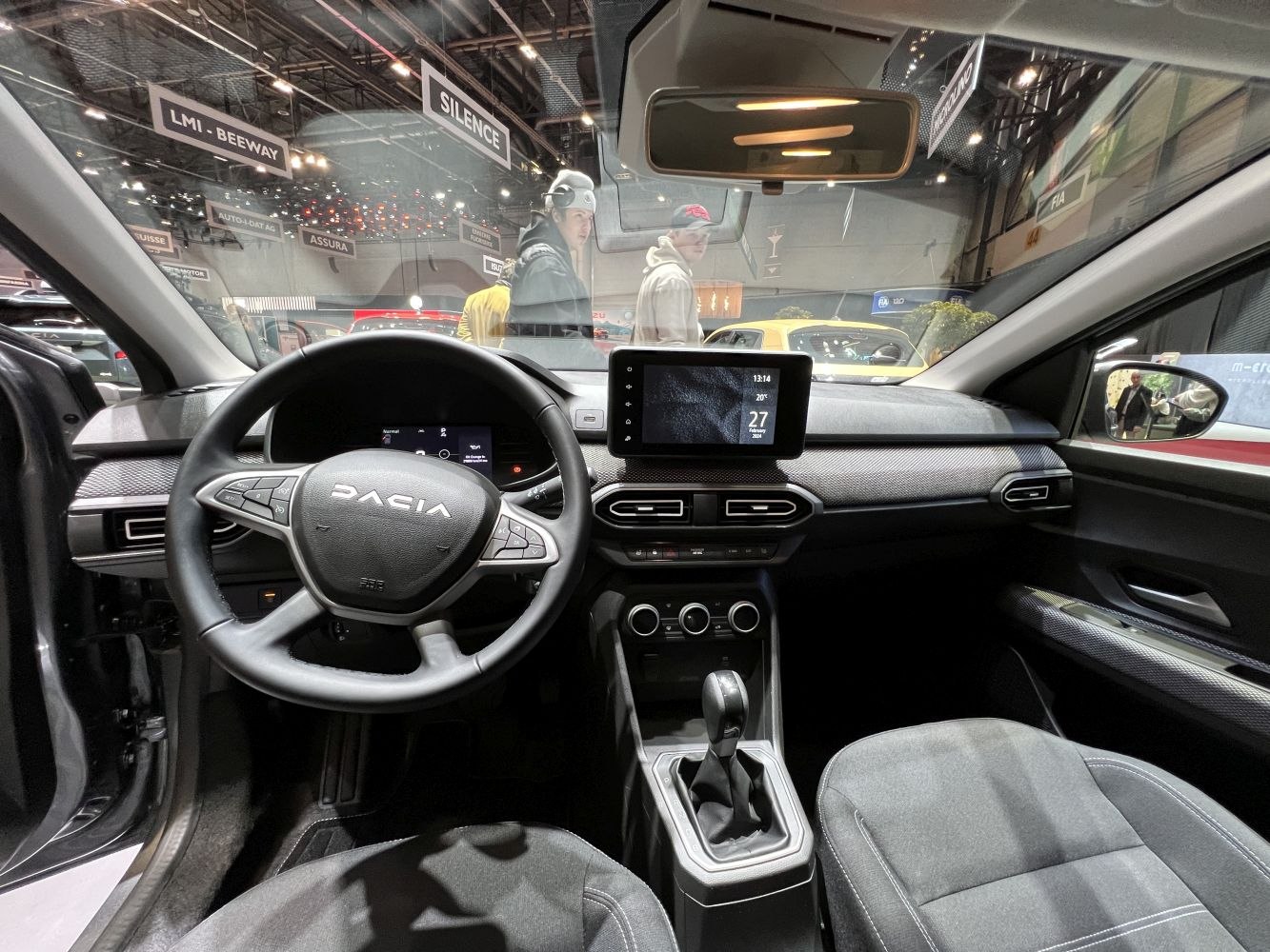 Dashboard and steering wheel with digital cluster and infotainment screen