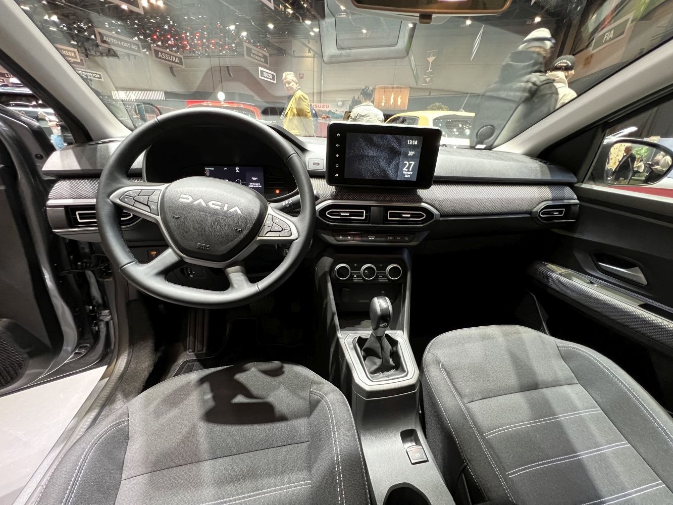 Touchscreen infotainment and digital instrument cluster in modern car interior