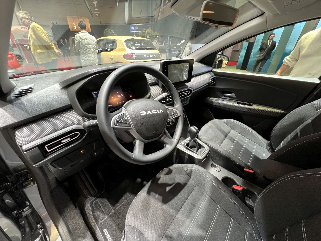 Modern car interior with dashboard, multifunction steering wheel, and touchscreen display