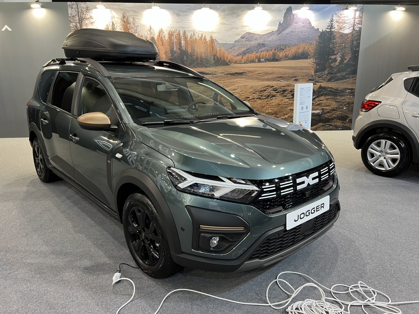 Facelifted vehicle with LED headlights and rooftop cargo box