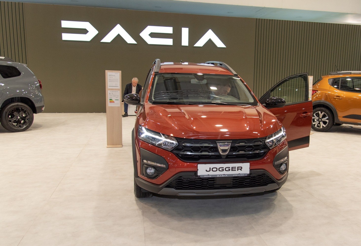 Front view of vehicle with honeycomb grille and sleek headlights