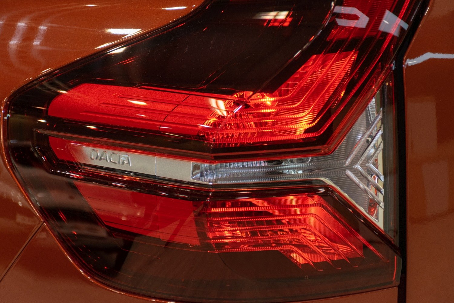 Close-up of a modern red and clear segmented LED tail light