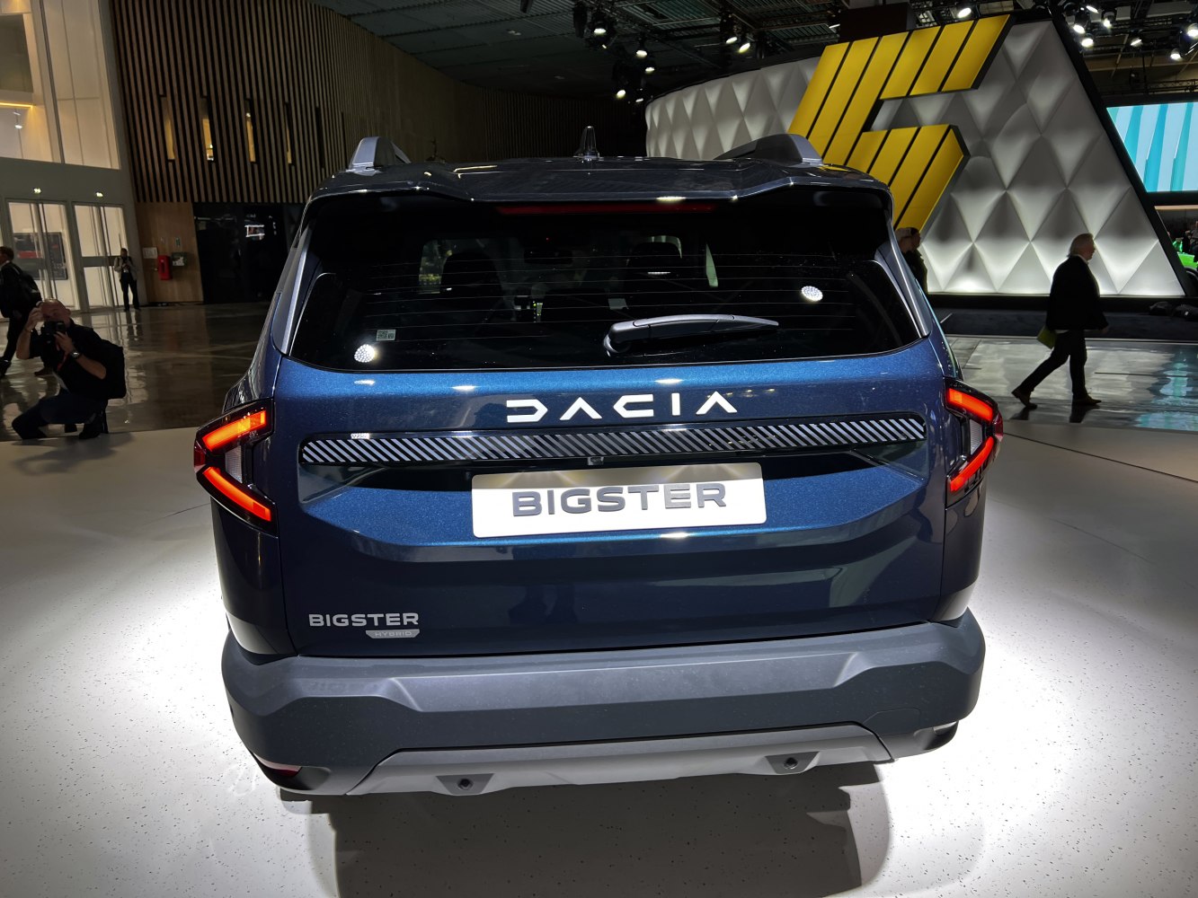 Rear view of hybrid SUV with modern taillights and branding