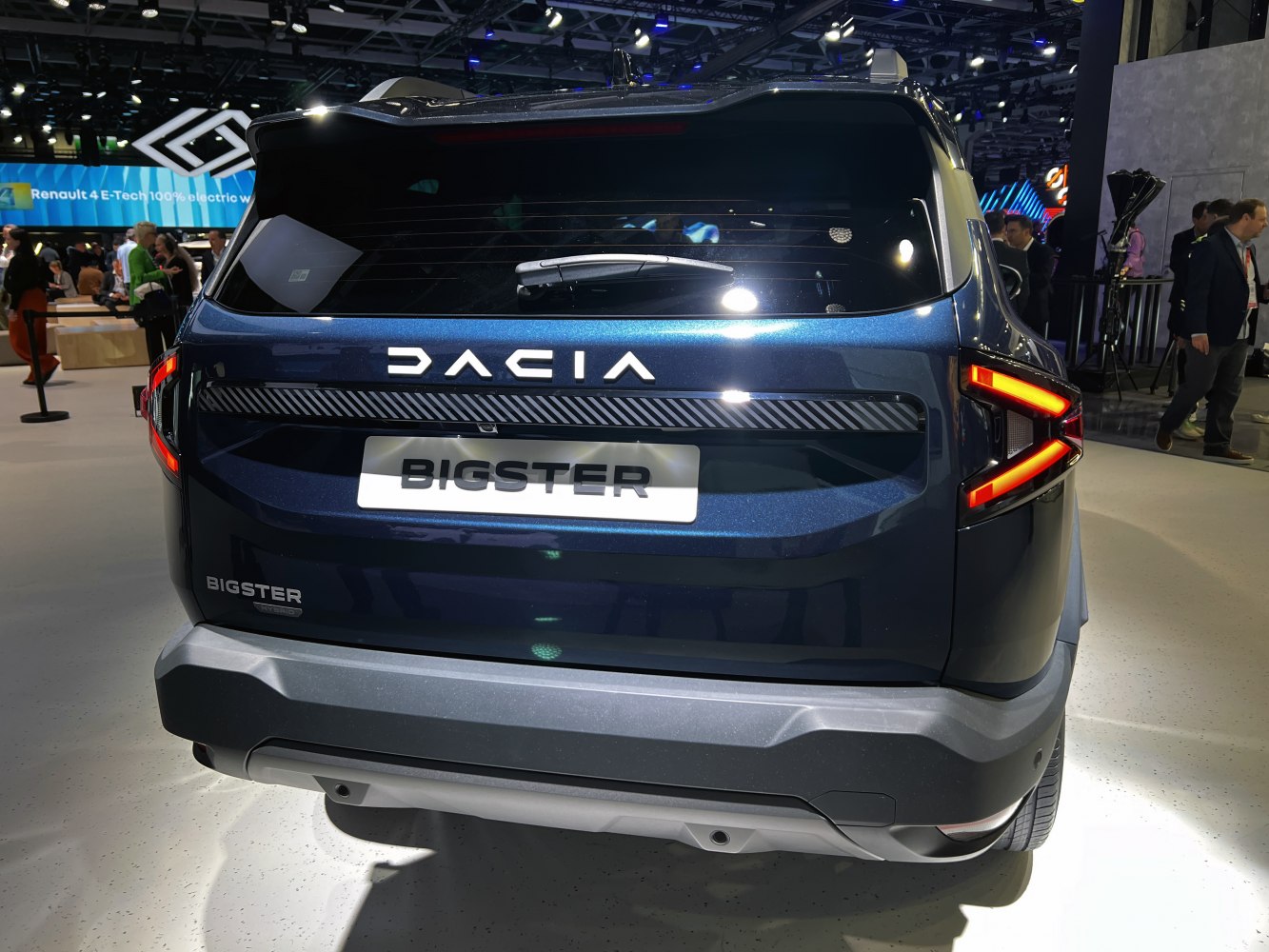 Rear view of modern SUV with distinctive LED taillights and bold badge.