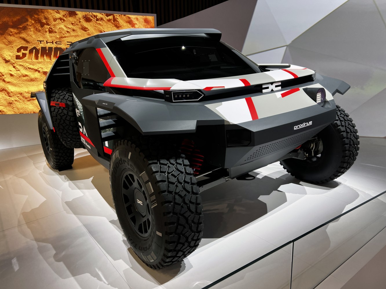 Futuristic off-road SUV with angular body and large rugged tires