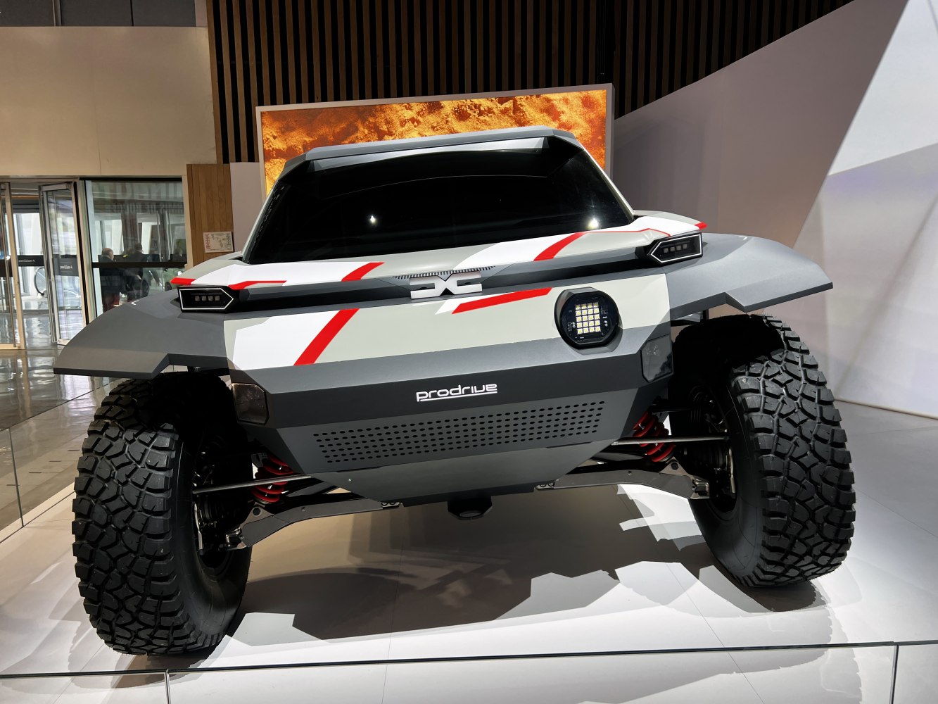 Futuristic off-road vehicle with aggressive tires and angular body design