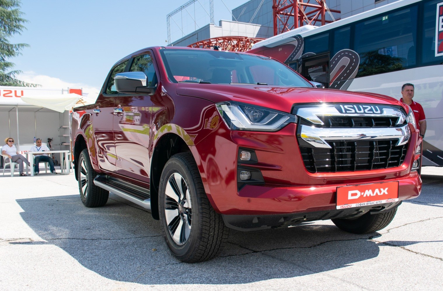 Bold front grille and modern headlights with side profile of double cab pickup