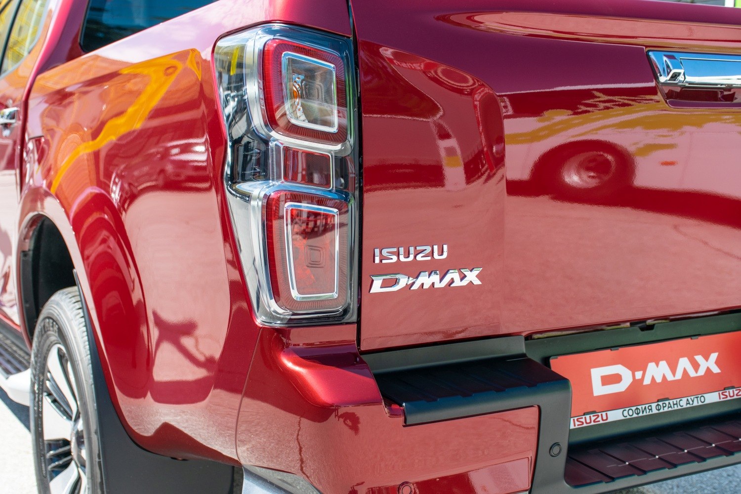 Close-up of pickup truck tail light and rear branding