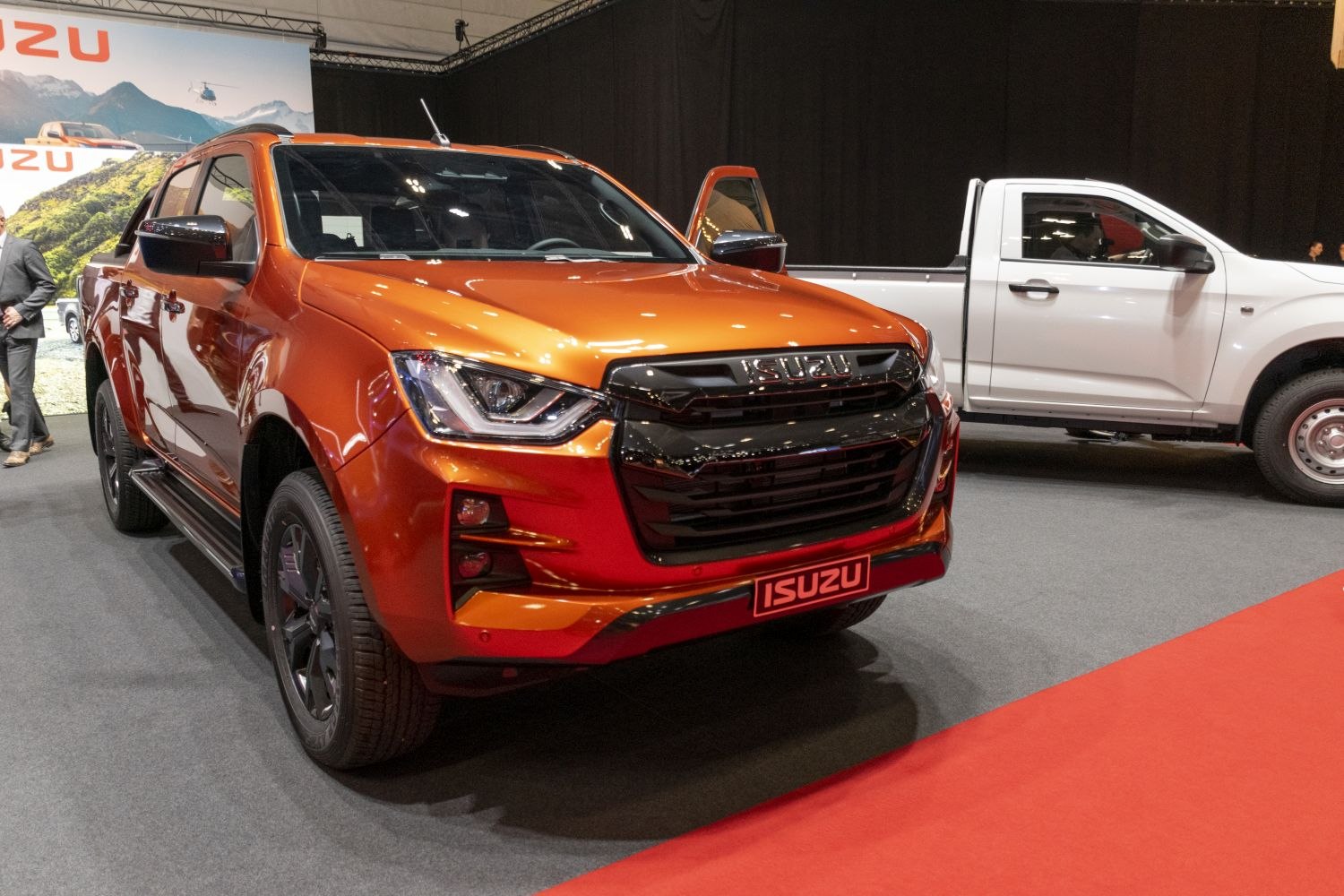 Front grille and headlight design of a pickup truck in orange