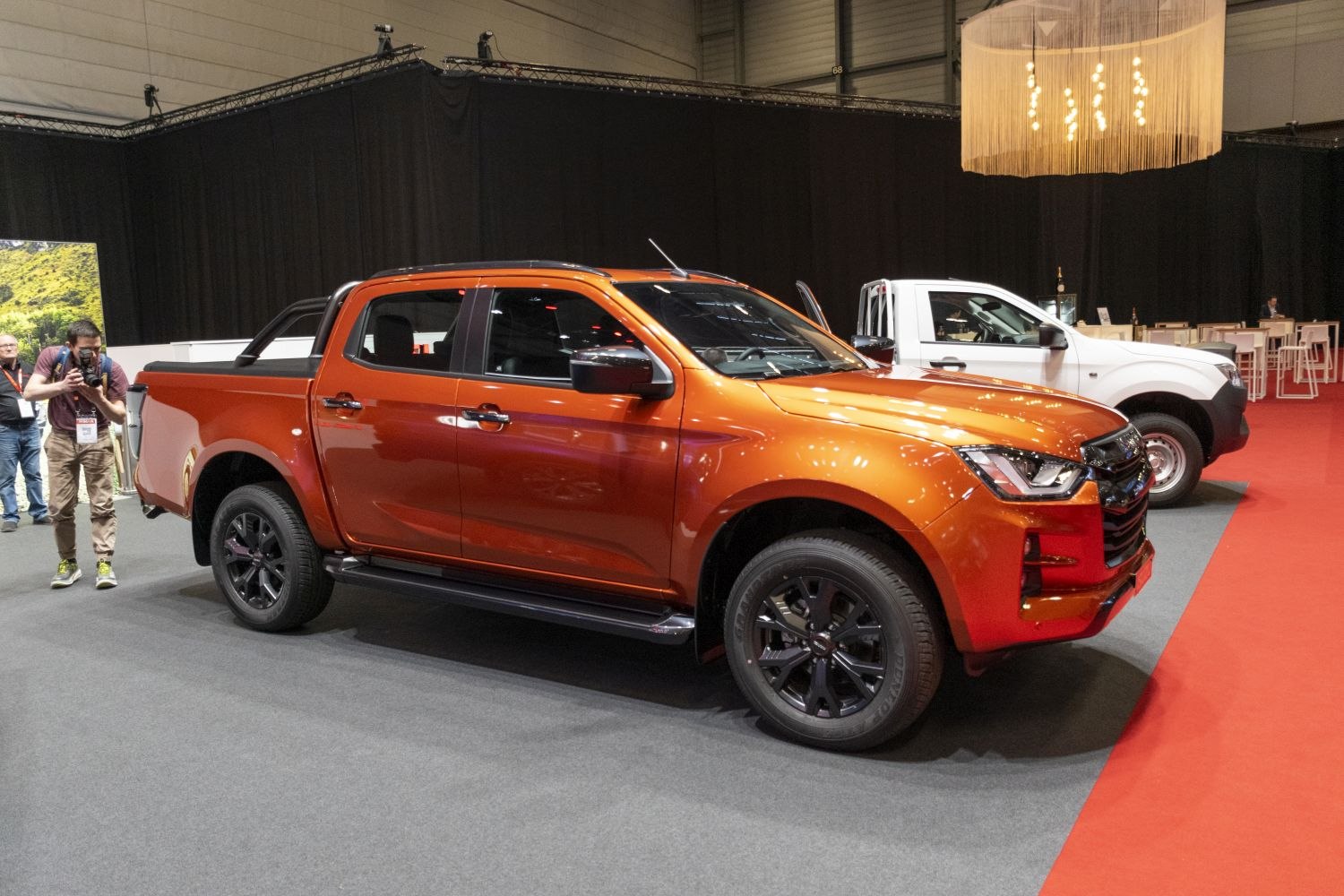 Double cab pickup with black alloy wheels and side steps
