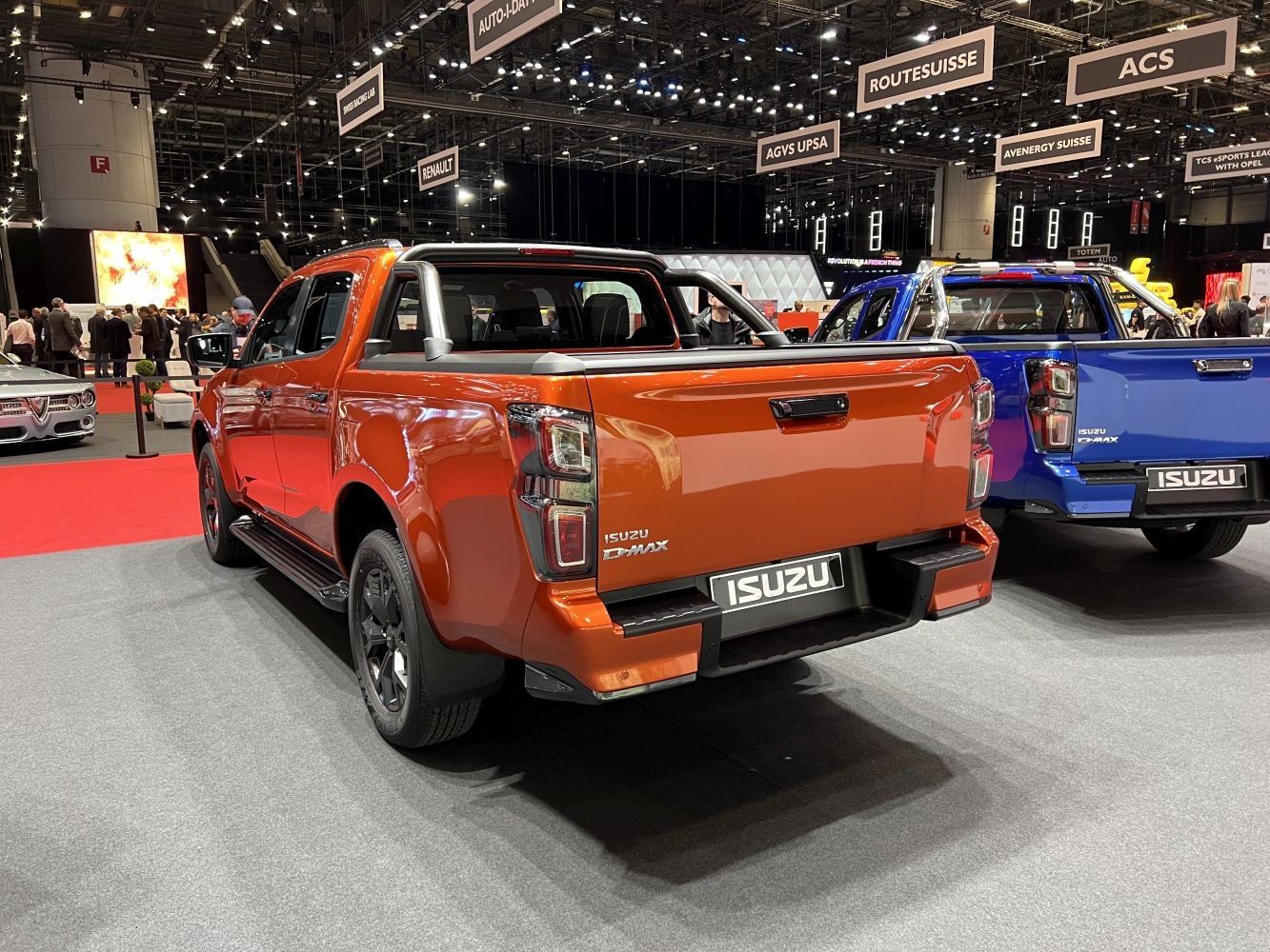 Rear view of modern double cab pickup trucks with distinct taillights and roll bars