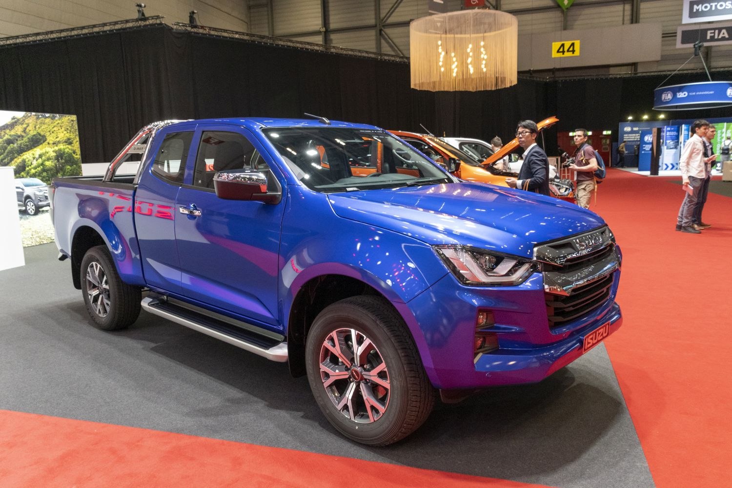Blue pickup truck with alloy wheels and modern headlights